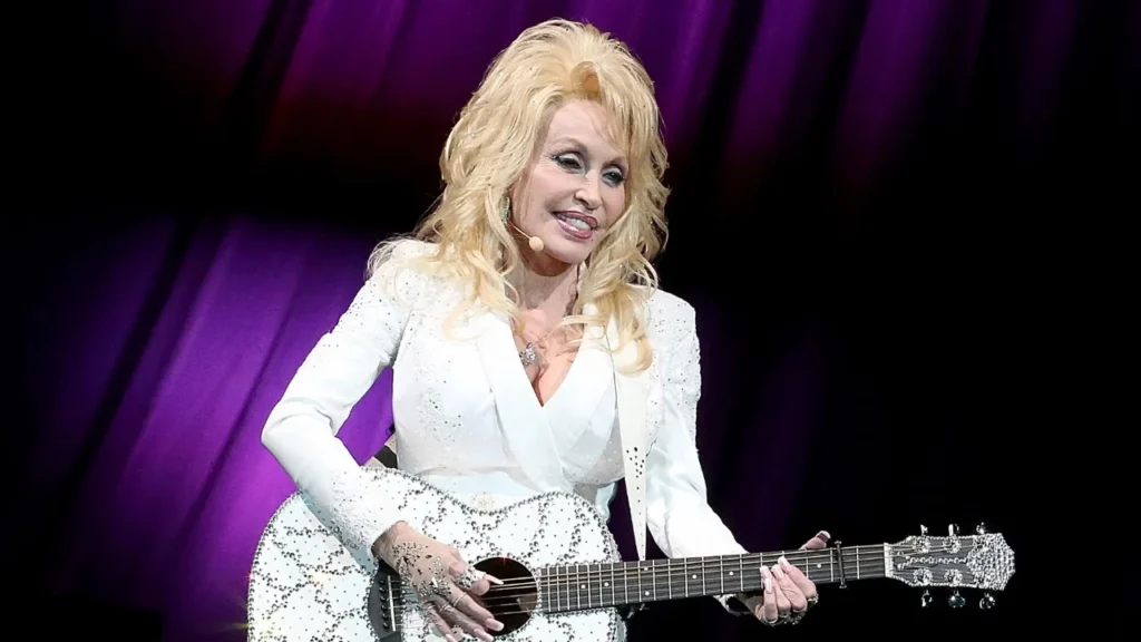why does dolly parton wear gloves and long sleeves

